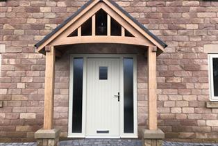 Bespoke residential entrance door with Oak canopy