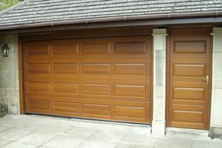 york sectional door with matching side door finished in goldern oak